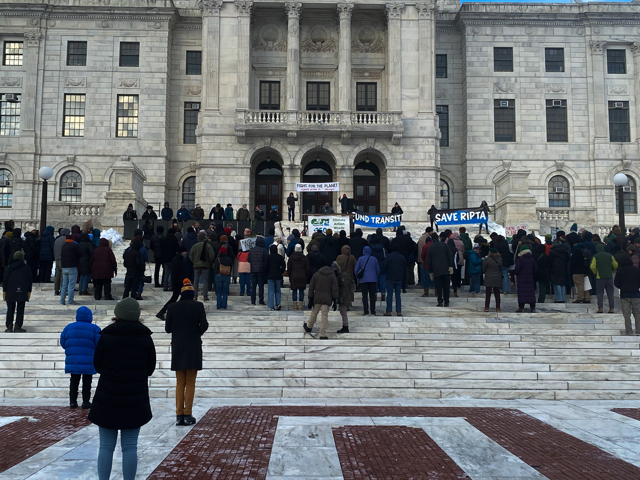 On presidential inauguration day, individuals gathered outside the Rhode Island State House in Providence for a “Rally for the Planet” event. | PHOTO: Will Holt