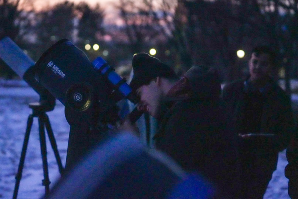 The University of Rhode Island students observed Mars, Venus and Jupiter outside East Hall on Friday night. PHOTO: Emma Roberts | Staff photographer