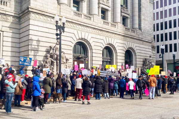 People gather in front of Kennedy Plaza in Providence for an emergency rally to protest Elon Musk’s new federal actions. PHOTO CREDIT: Will Holt | Staff Reporter