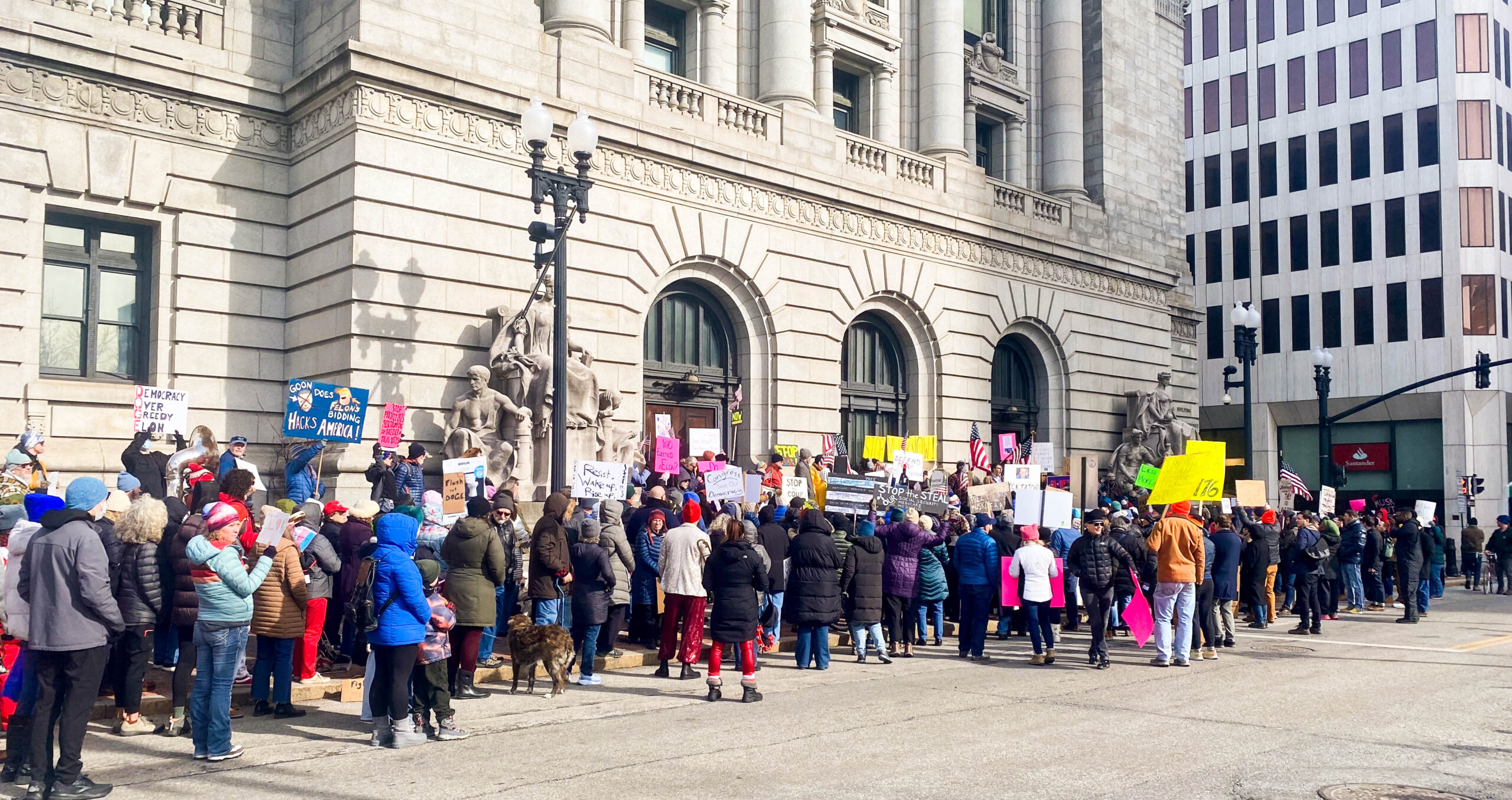 People gather in front of Kennedy Plaza in Providence for an emergency rally to protest Elon Musk’s new federal actions. PHOTO CREDIT: Will Holt | Staff Reporter