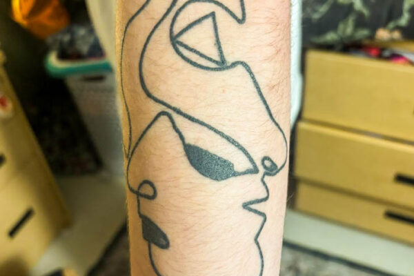 Peyton Vesneski’s abstract twin faces tattoo on his left forearm. PHOTO CREDIT: Olivia Bull | Contributing Photographer