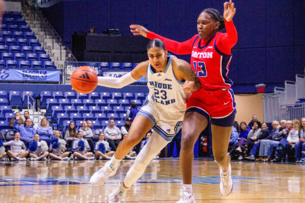 Fourth-year center Harsimran "Honey" Kaur looks for an open teammate up the court. Kaur had eight points and three assists against Dayton. Third-year forward Anaelle Dutat had 13 points in URI’s win against Dayton. PHOTO CREDIT: Christina Lancellotta | Staff Photographer