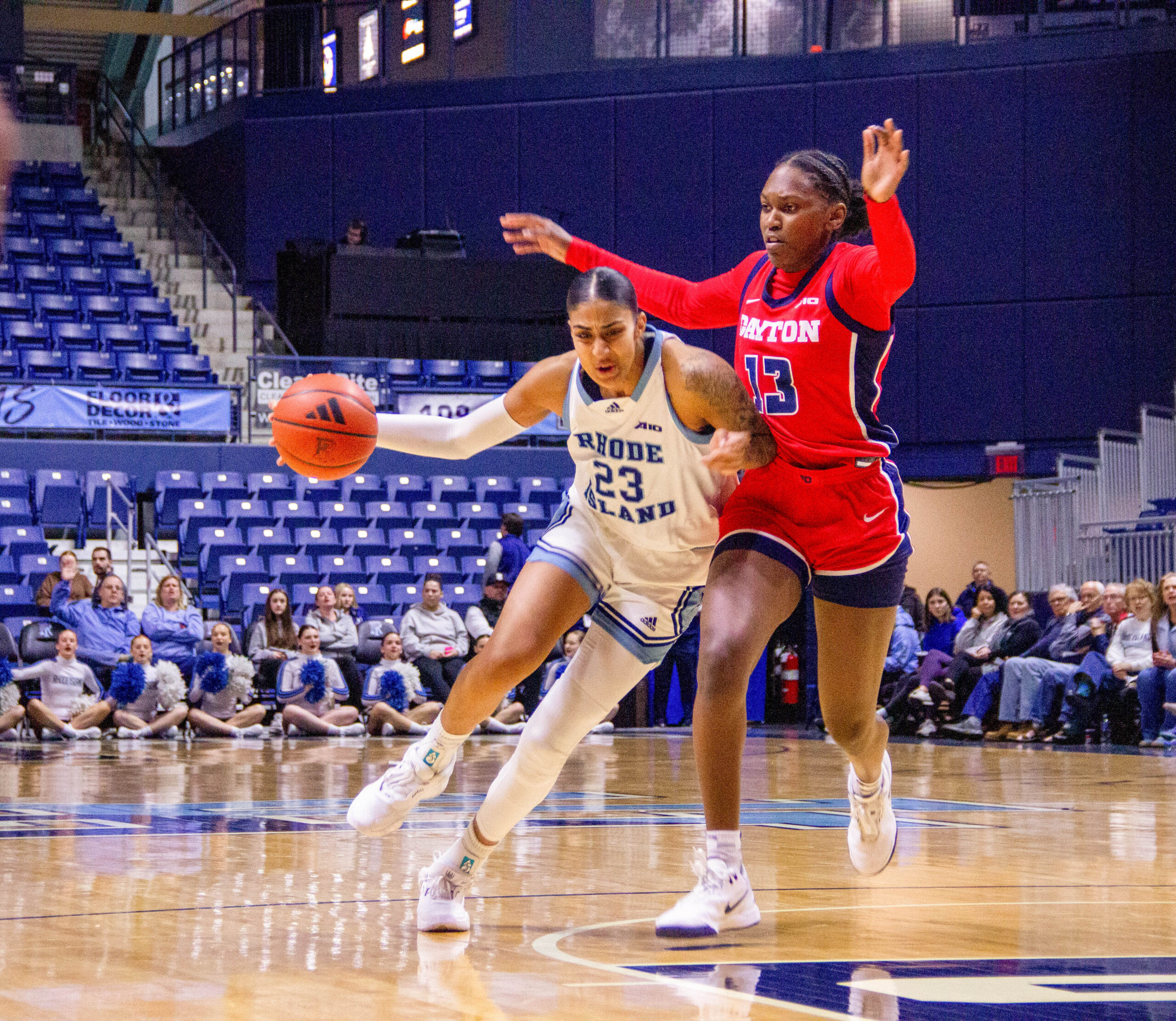 Fourth-year center Harsimran "Honey" Kaur looks for an open teammate up the court. Kaur had eight points and three assists against Dayton. Third-year forward Anaelle Dutat had 13 points in URI’s win against Dayton. PHOTO CREDIT: Christina Lancellotta | Staff Photographer