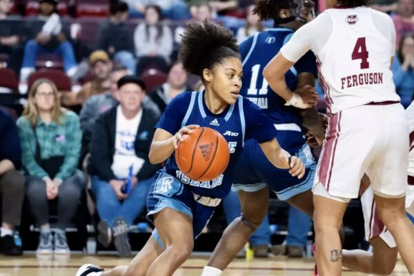 Second-year guard Sophia Vital lunges past the UMass defense. PHOTO CREDIT: Michaela Benford / GoRhody.com