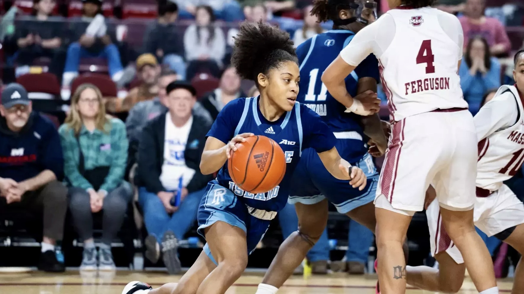 Second-year guard Sophia Vital lunges past the UMass defense. PHOTO CREDIT: Michaela Benford / GoRhody.com