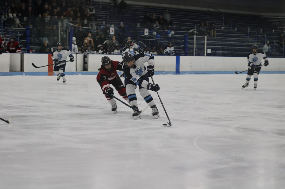 Second-year defenseman Penny Spack dodges a UMass defender. PHOTO CREDIT: Sky Connor | Staff Photographer