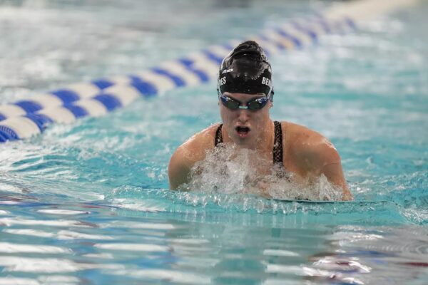 Fourth-year swimmer Hannah Benavides places sixth in the 200-Yard Breaststroke at the A10 Championship. PHOTO CREDIT: GoRhody.com