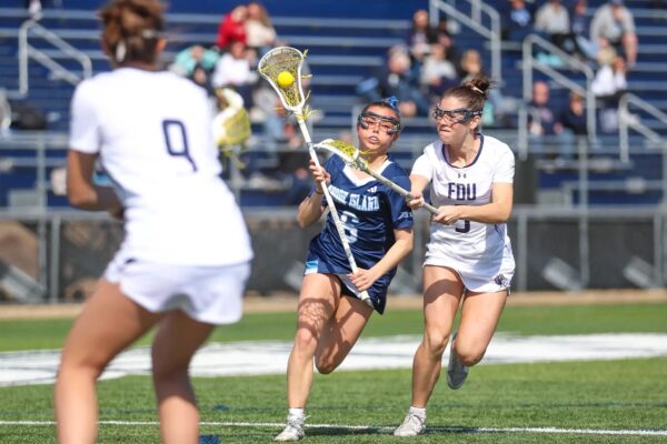 Second-year attacker Danielle McHugh scores in each quarter, totaling five goals in the Rams’ win against Fairleigh Dickinson. PHOTO CREDIT: Kenny Sposato / GoRhody.com