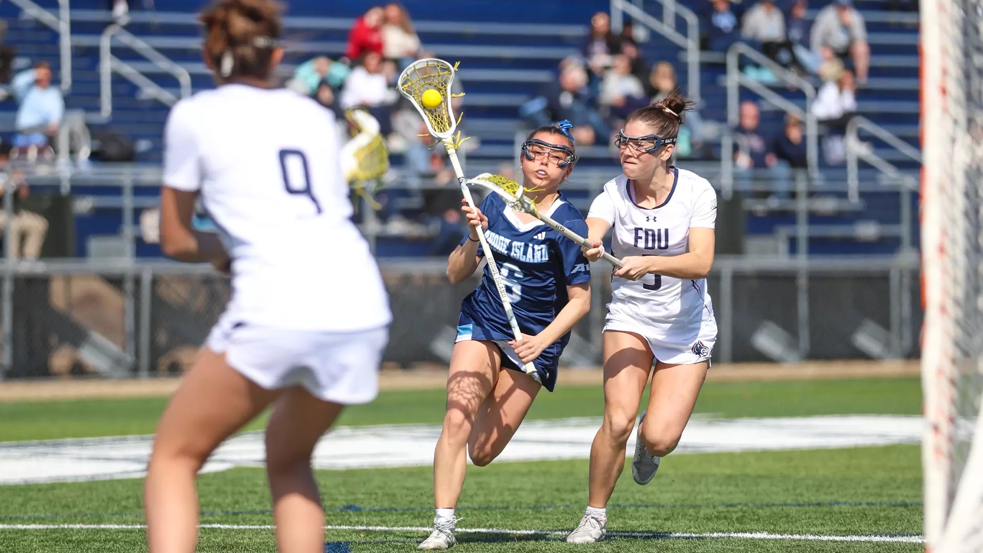 Second-year attacker Danielle McHugh scores in each quarter, totaling five goals in the Rams’ win against Fairleigh Dickinson. PHOTO CREDIT: Kenny Sposato / GoRhody.com