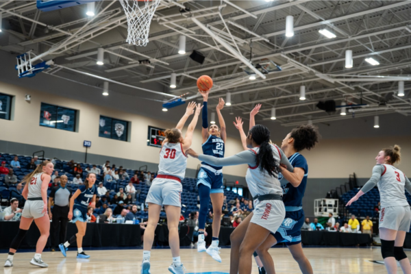 Fourth-year center Harsimran “Honey” Kaur takes a jumper in Rhode Island’s quarterfinal loss to Saint Joseph’s. PHOTO CREDIT: Bella Kelley | GoRhody.com