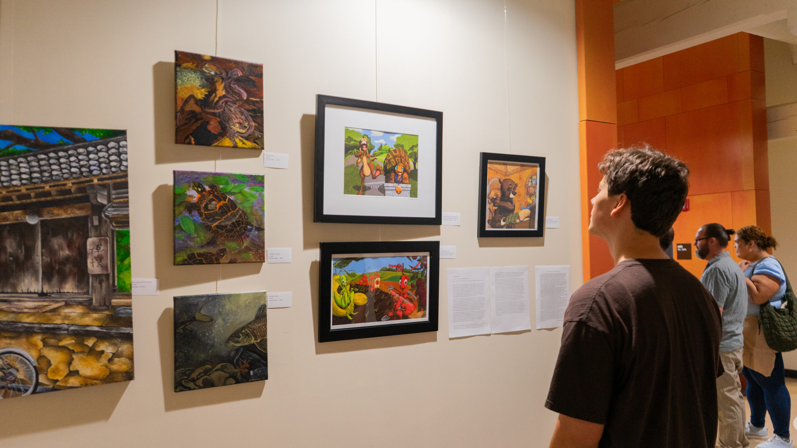 Artwork in the “Education, Behind the Curtain” exhibit in Lippitt Hall. PHOTO CREDIT: Aidan Cahill | Contributing Photographer